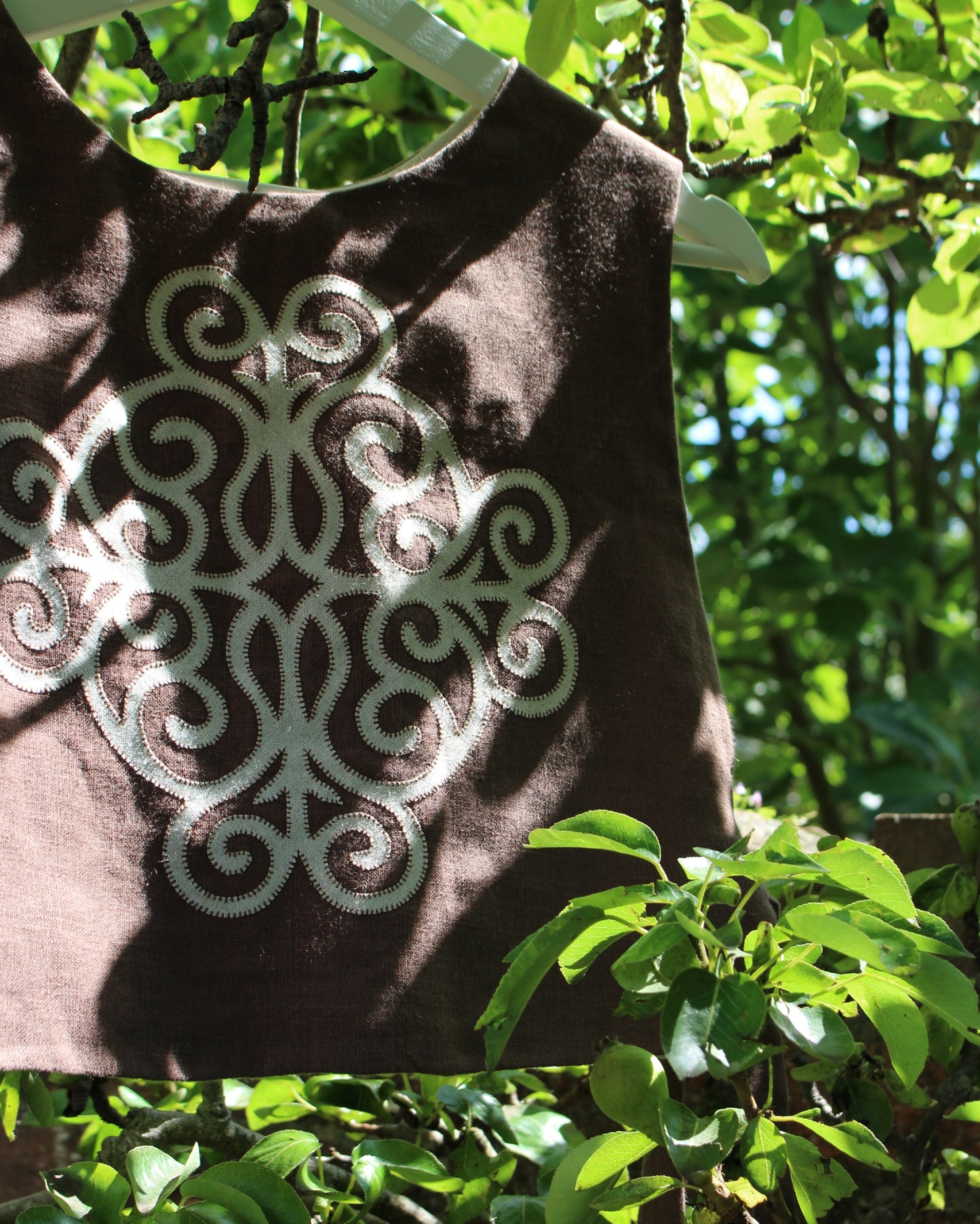 Coiling Medieval Relic on Brown Linen