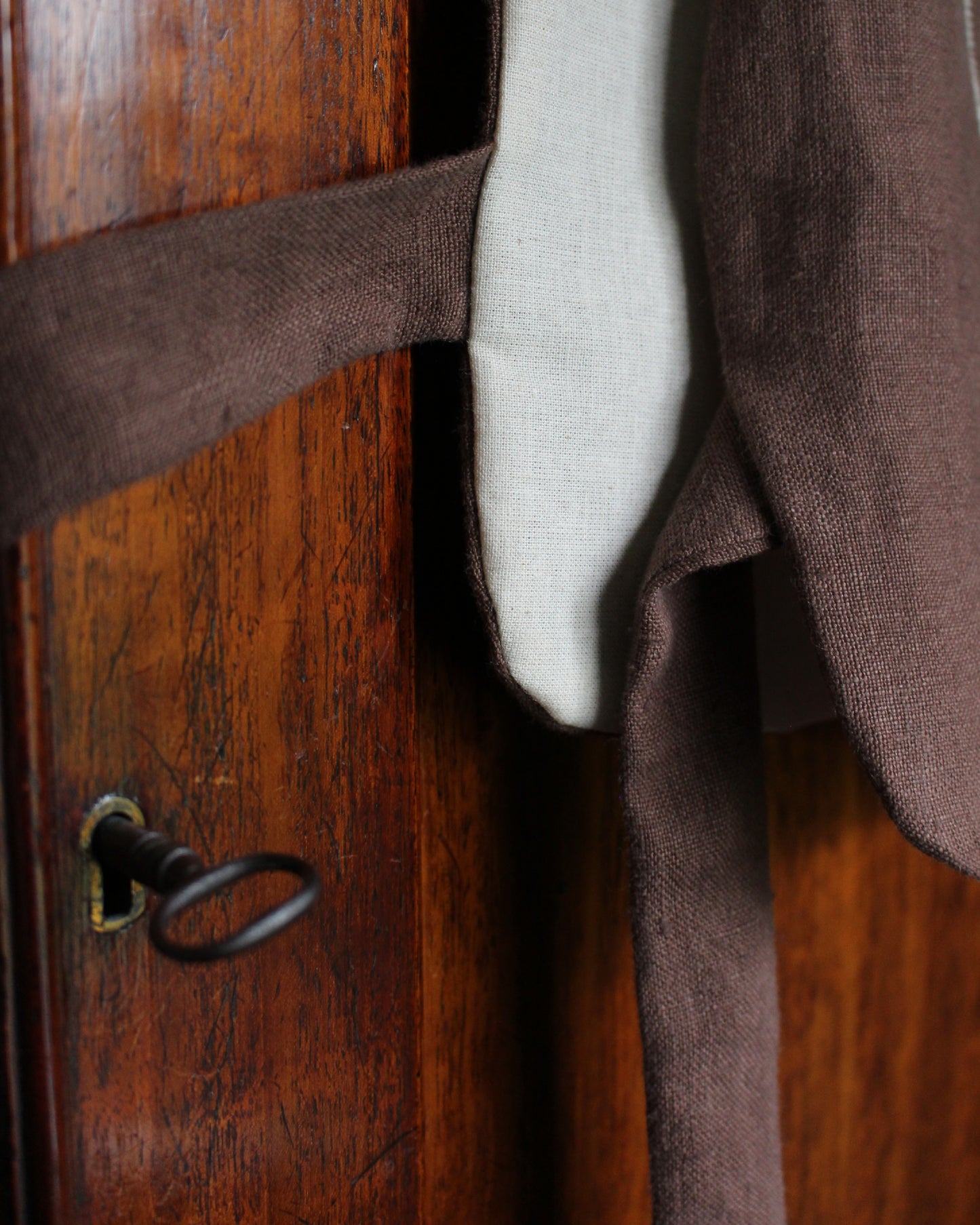 Coiling Medieval Relic on Brown Linen