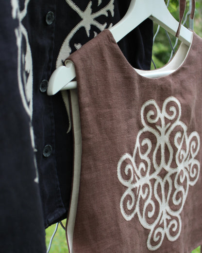 Coiling Medieval Relic on Brown Linen