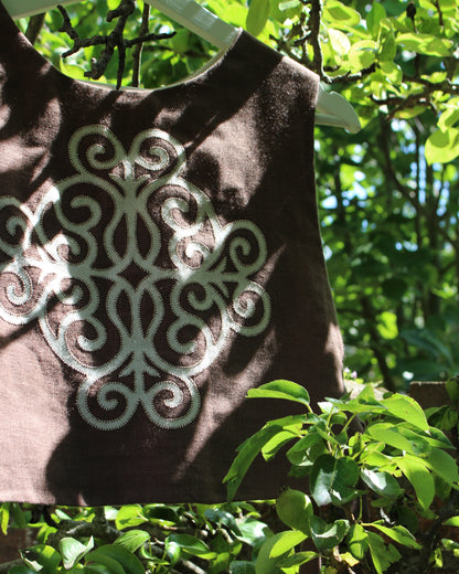 Coiling Medieval Relic on Brown Linen