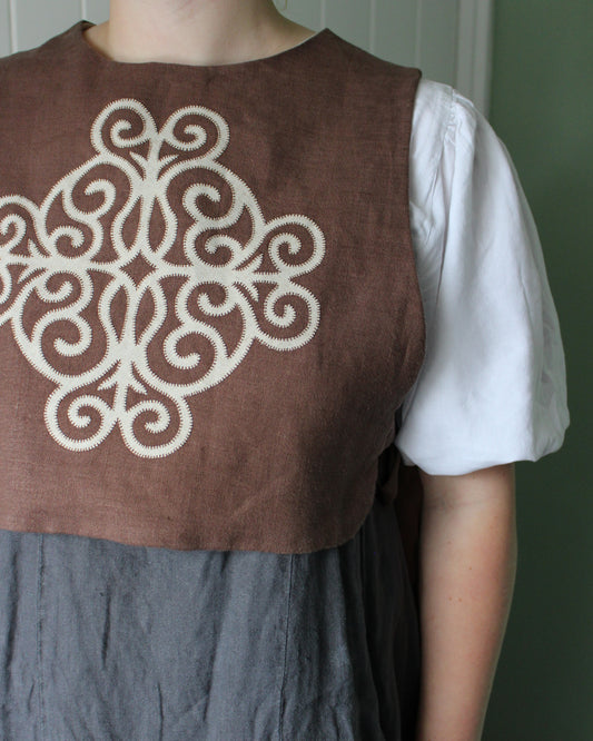 Coiling Medieval Relic on Brown Linen