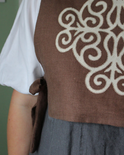 Coiling Medieval Relic on Brown Linen