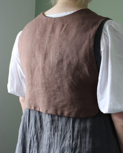 Coiling Medieval Relic on Brown Linen