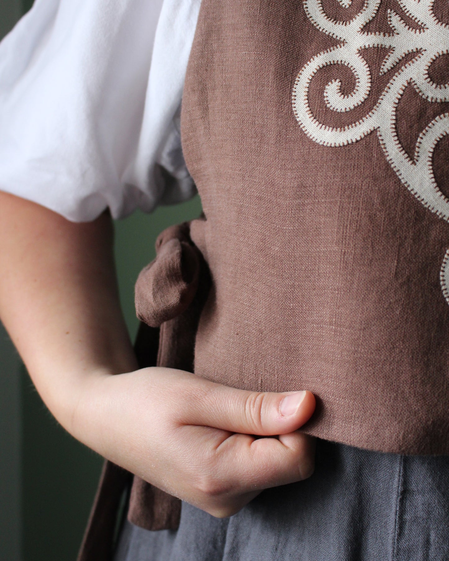 Coiling Medieval Relic on Brown Linen