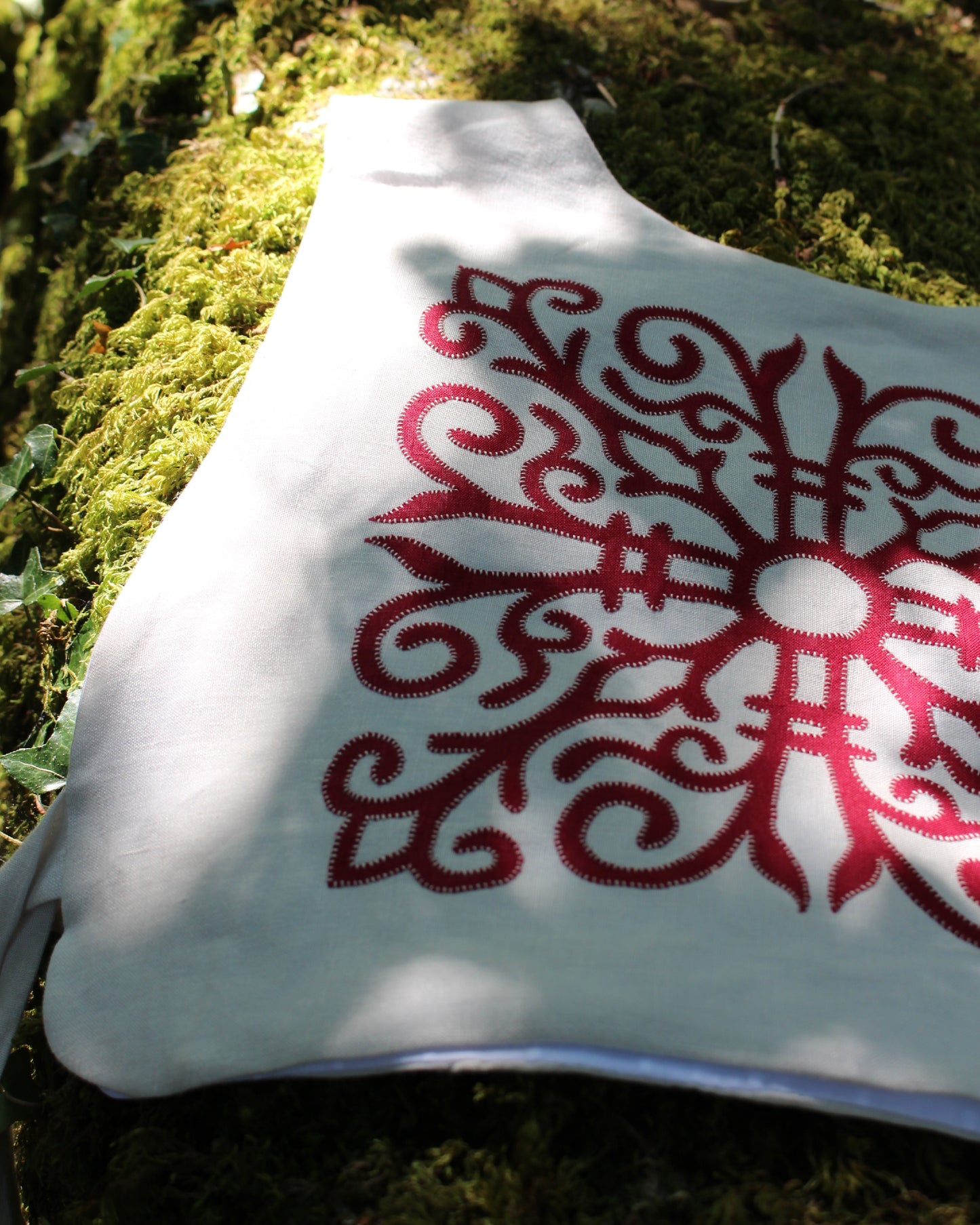 Red Celtic Ornamental Tile on Chalk White Linen