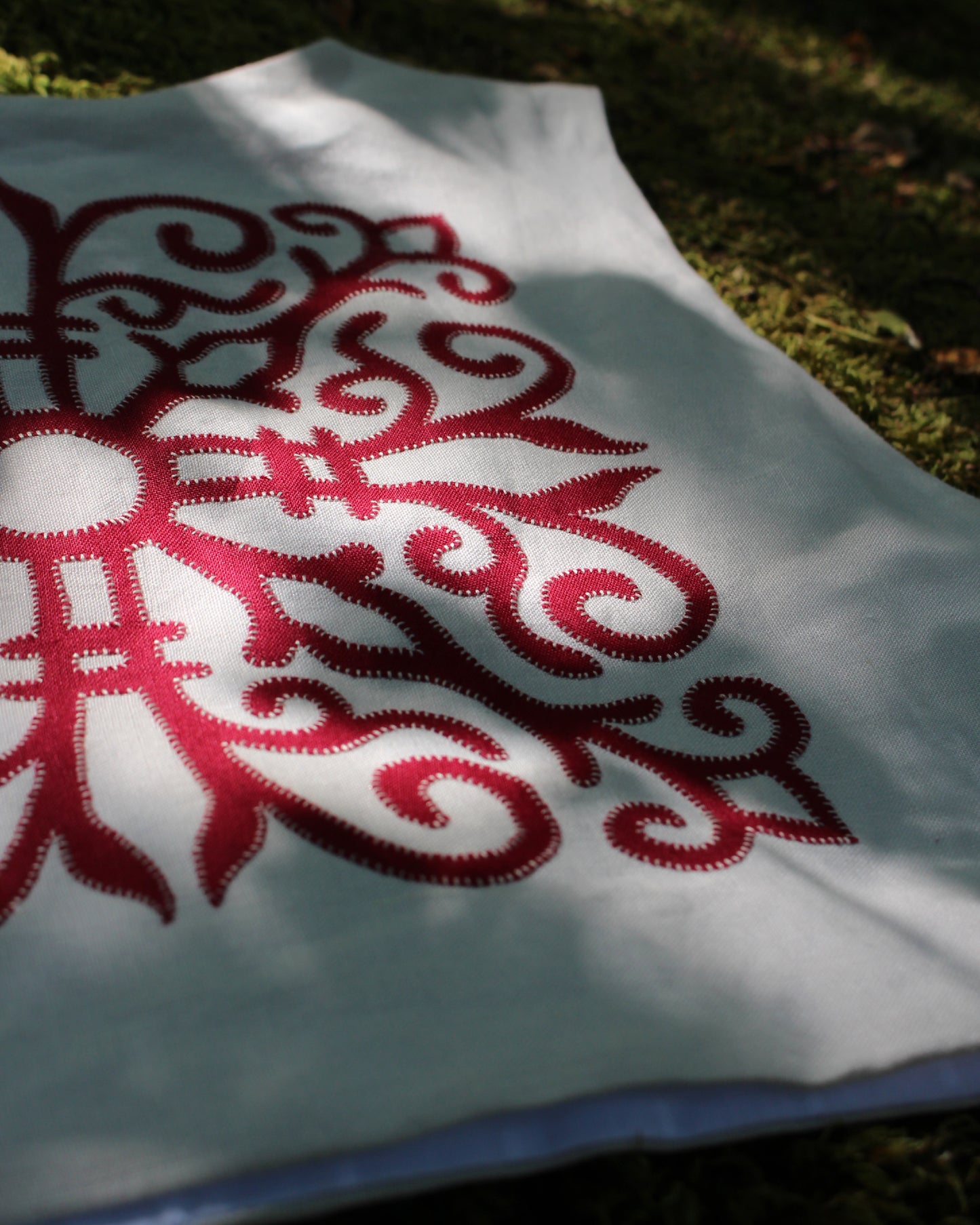 Red Celtic Ornamental Tile on Chalk White Linen
