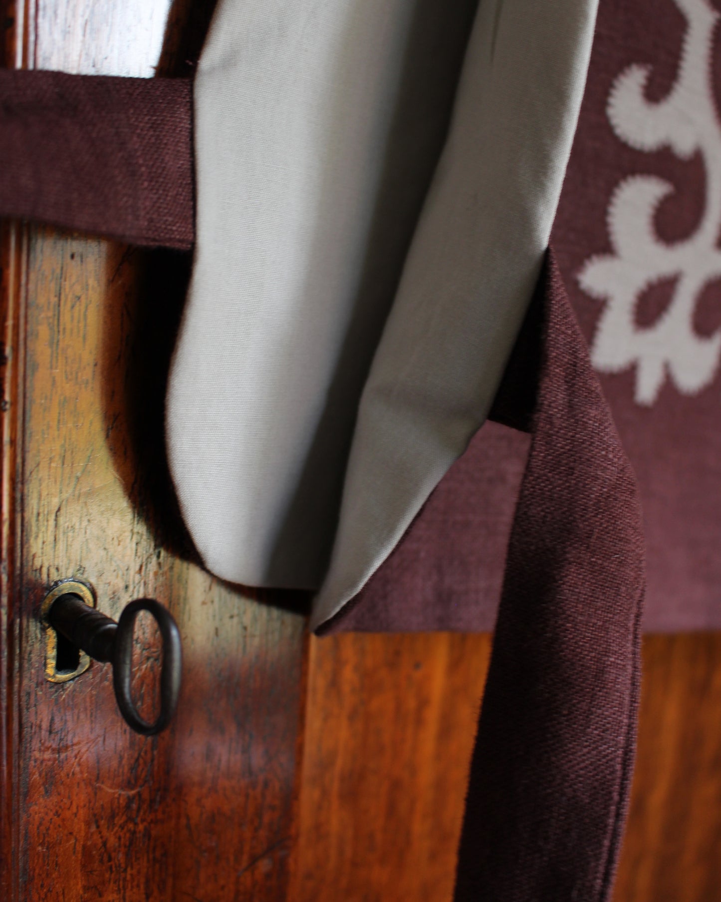 Tudor Tile on Dark Burgundy Plum Linen