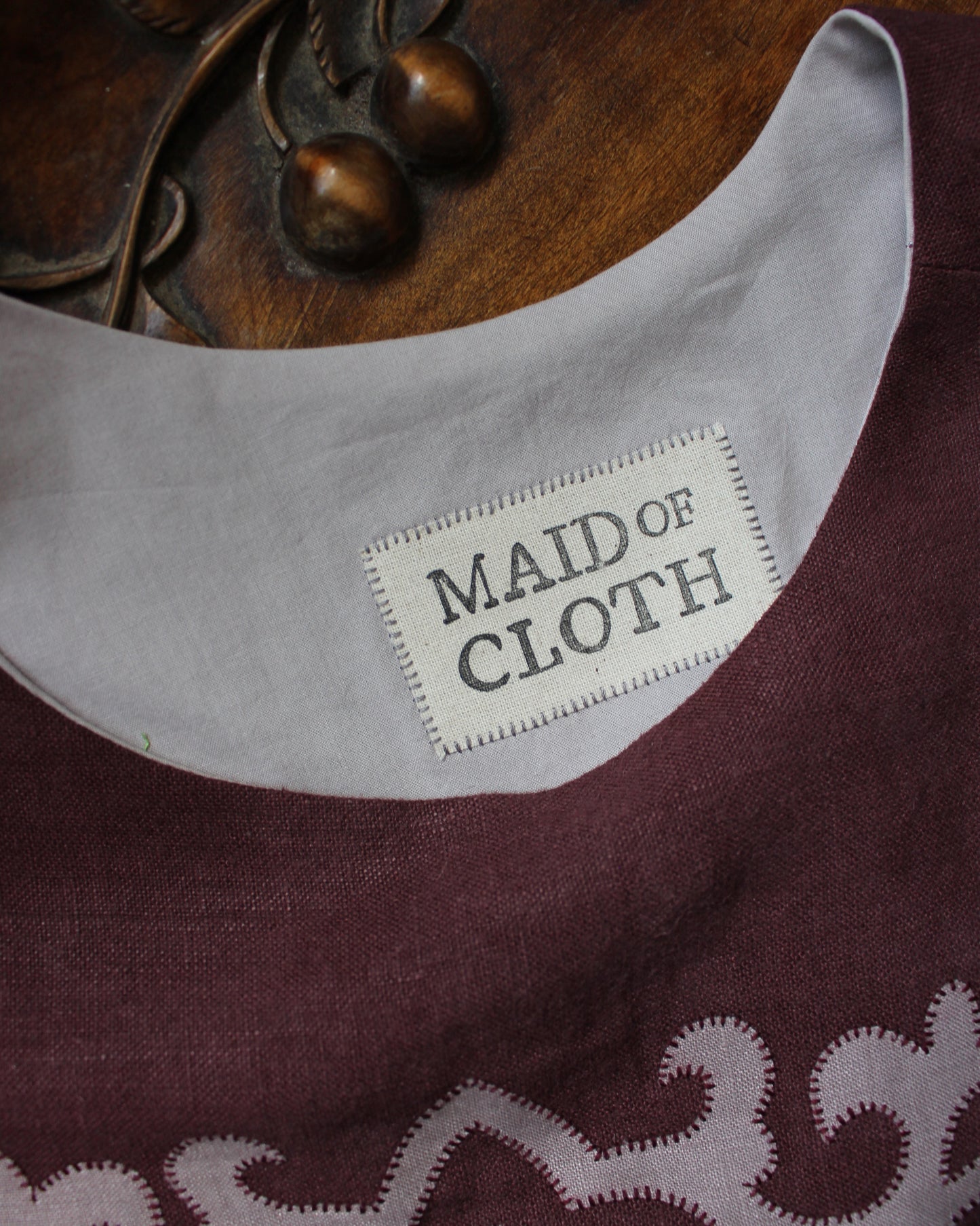 Tudor Tile on Dark Burgundy Plum Linen