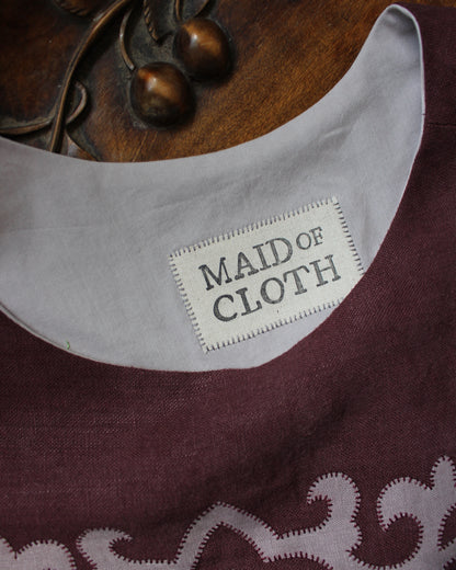 Tudor Tile on Dark Burgundy Plum Linen